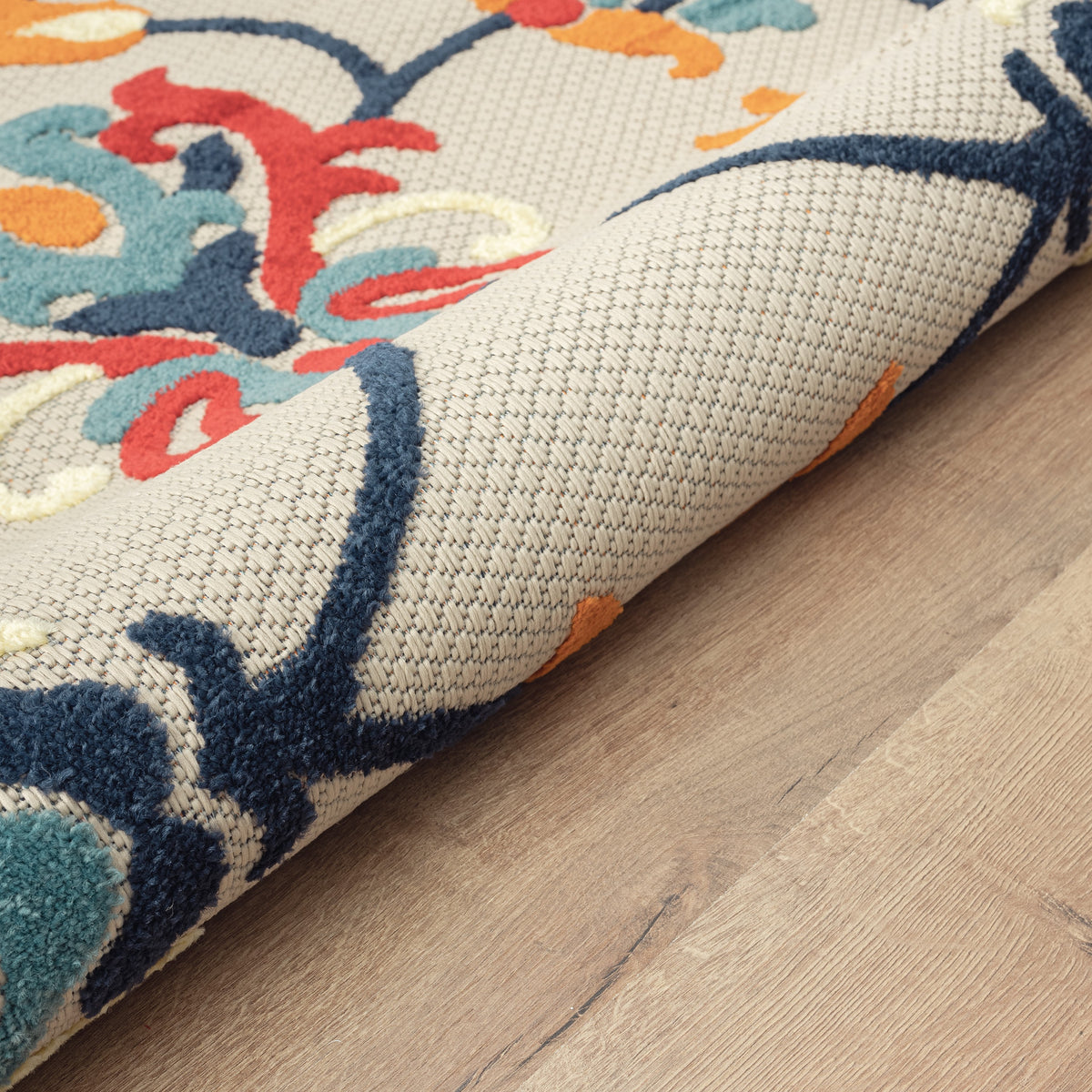 Ox Bay Orange Coastal Floral Filigree Hi-Low Indoor/Outdoor Area Rug - close-up detail