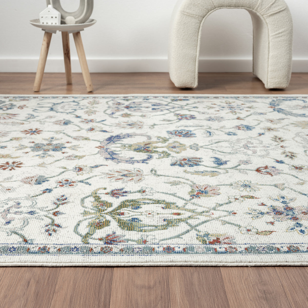 Ivory/Blue Bordered Traditional Indoor Area Rug - side angle view