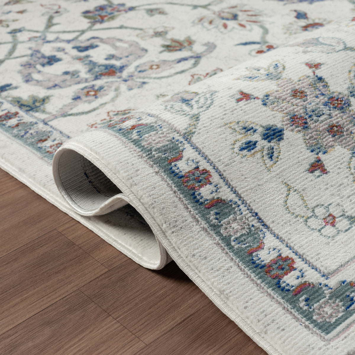 Ivory/Blue Bordered Traditional Indoor Area Rug - close-up detail