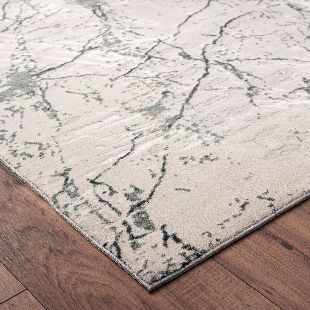 Imagine Ivory Abstract Modern/Contemporary Polyester Area Rug - side angle view