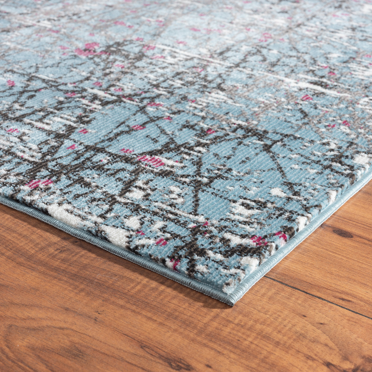 Impulse Abstract Fuchsia Splatter Fusion Area Rug - side angle view