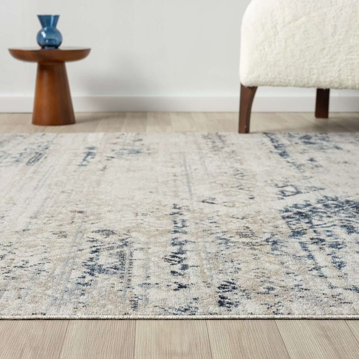 Ivory/Blue Classic Medallion Polyester Washable Indoor Area Rug - side angle view