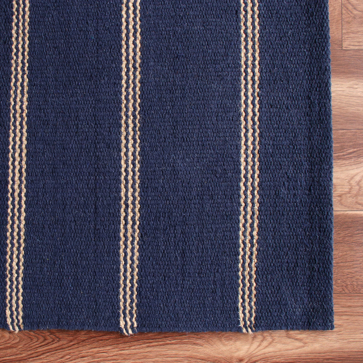 Navy Striped Handwoven Jute Area Rug - corner view