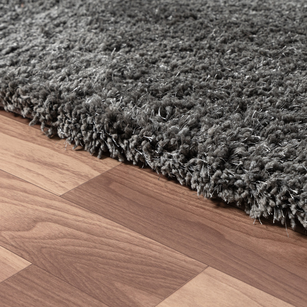 Black Shag Solid Hand-Loomed Polyester Indoor Area Rug - side angle view