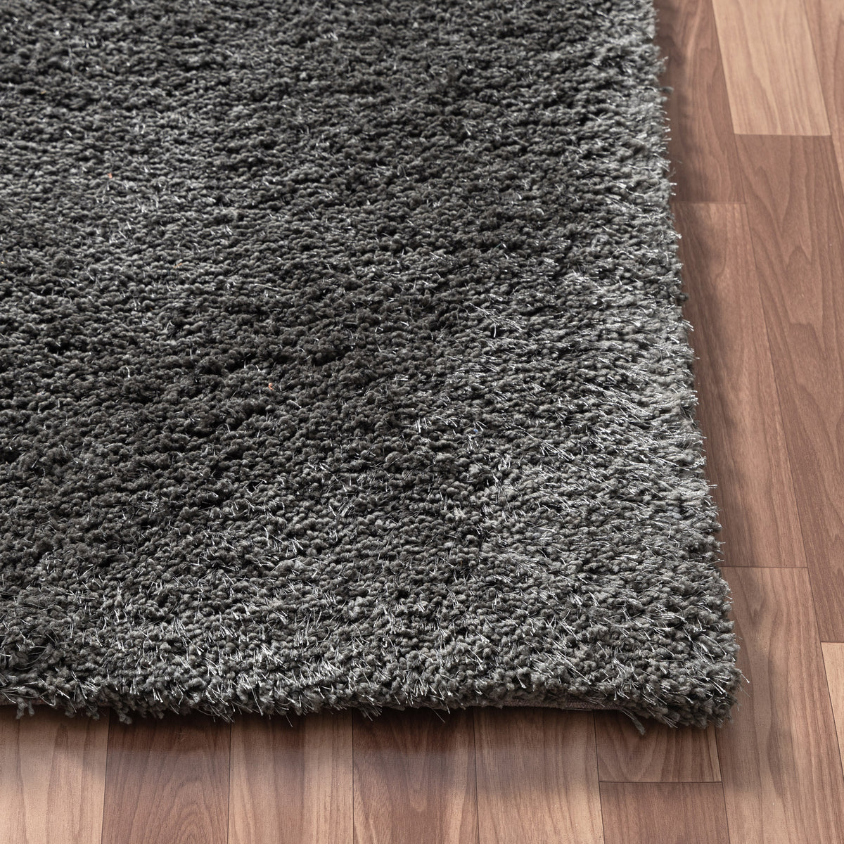 Black Shag Solid Hand-Loomed Polyester Indoor Area Rug - corner view