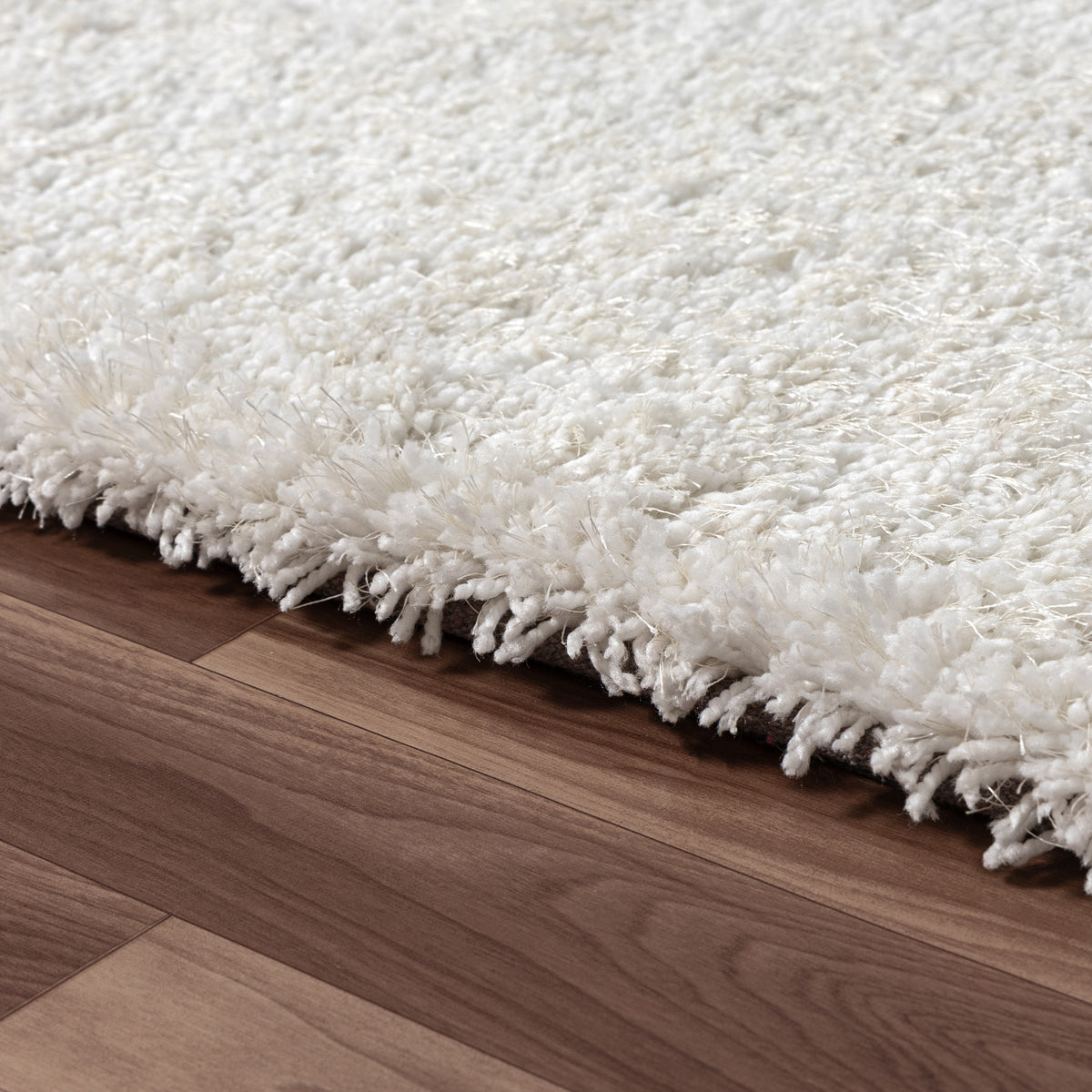 Ivory Shag Solid Hand-Loomed Polyester Indoor Area Rug - side angle view