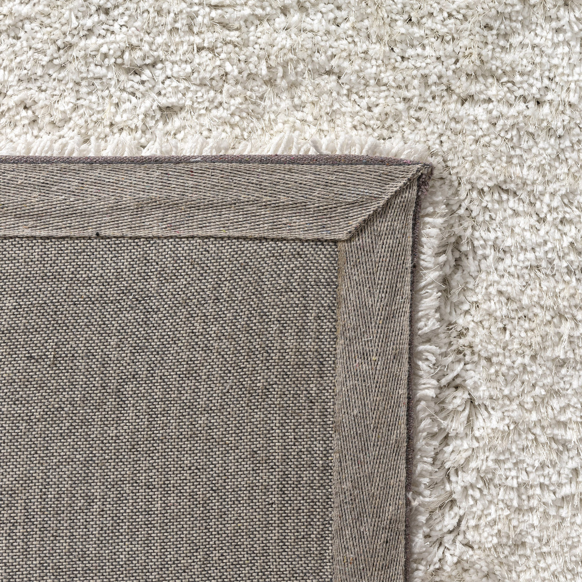 Ivory Shag Solid Hand-Loomed Polyester Indoor Area Rug - back view