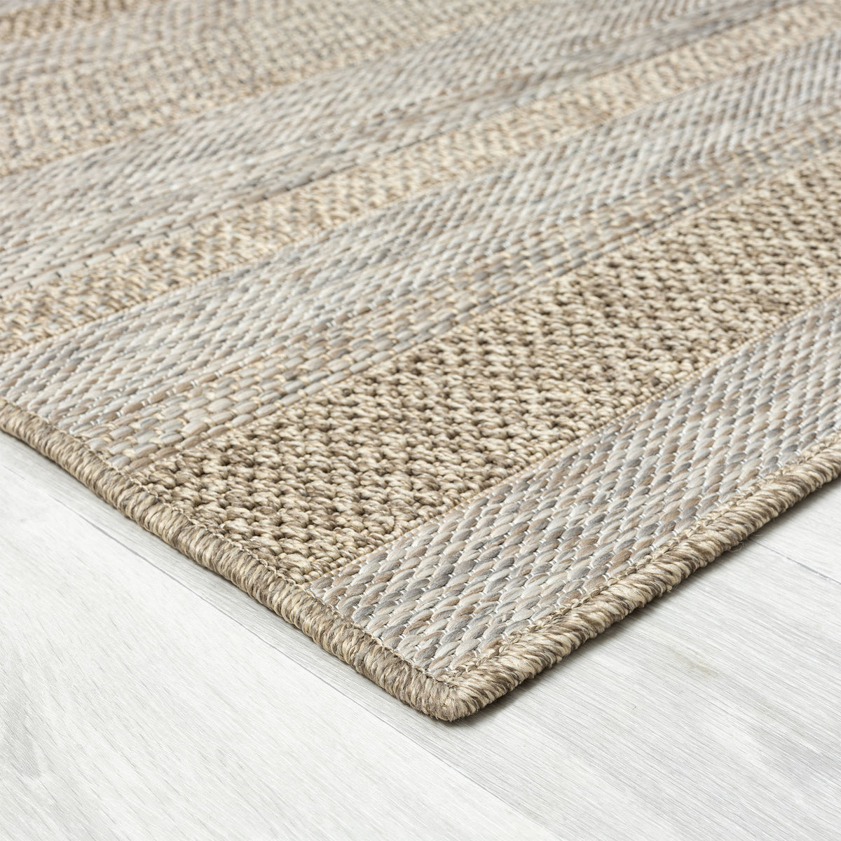 Oslo Modern Striped Brown Indoor Outdoor Area Rug - side angle view
