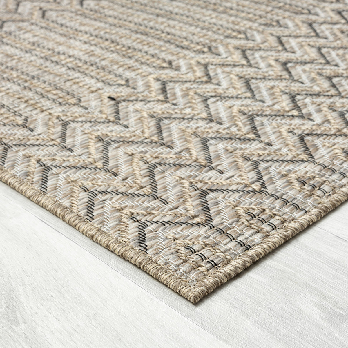 Oslo Modern Chevron Brown Indoor Outdoor Area Rug - side angle view