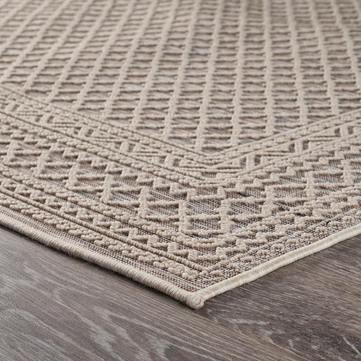 Natural-Toned Classic Geometric Indoor/Outdoor Rug - side angle view