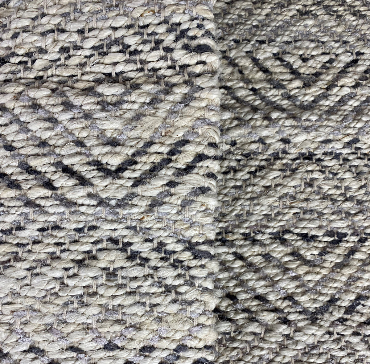 Hand-Woven Geometric Gray and Jute Rug - side angle view