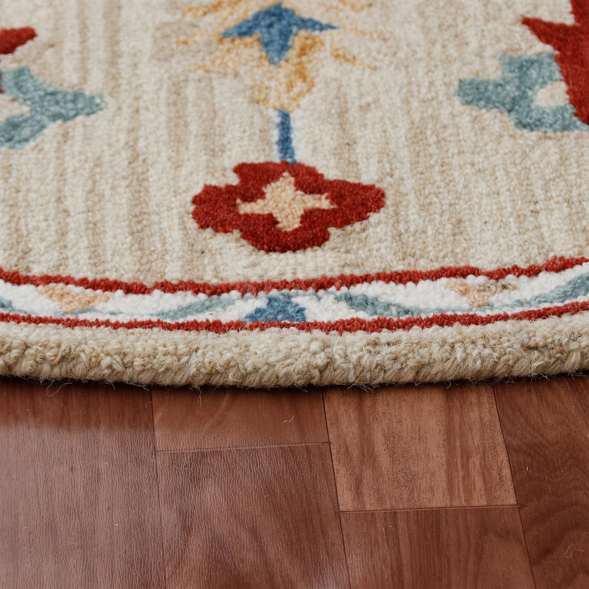 RugsA Beige/Blue Medallion Wool Round Rug - side angle view