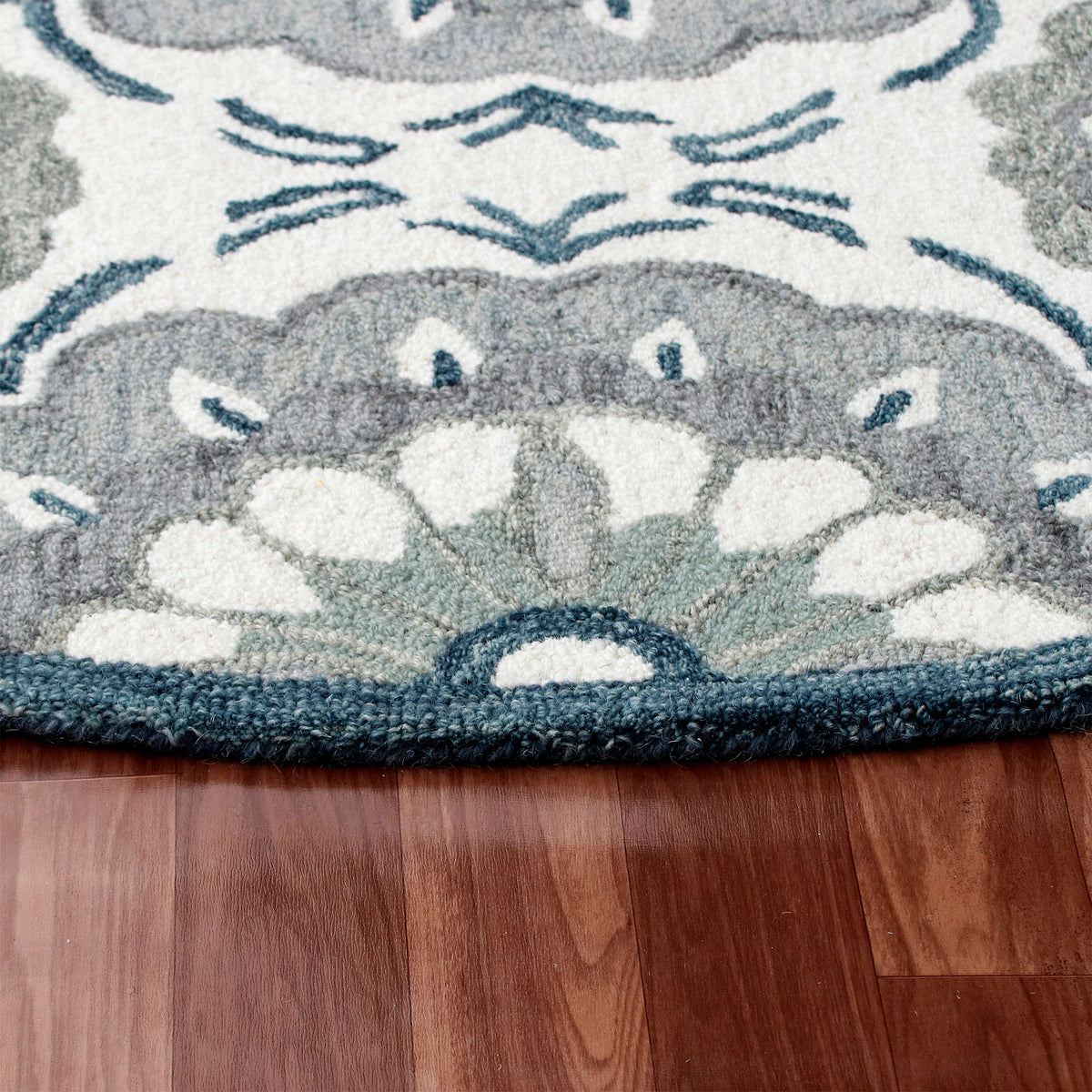 RugsA Ivory/Gray Suzani Wool Round Rug - side angle view