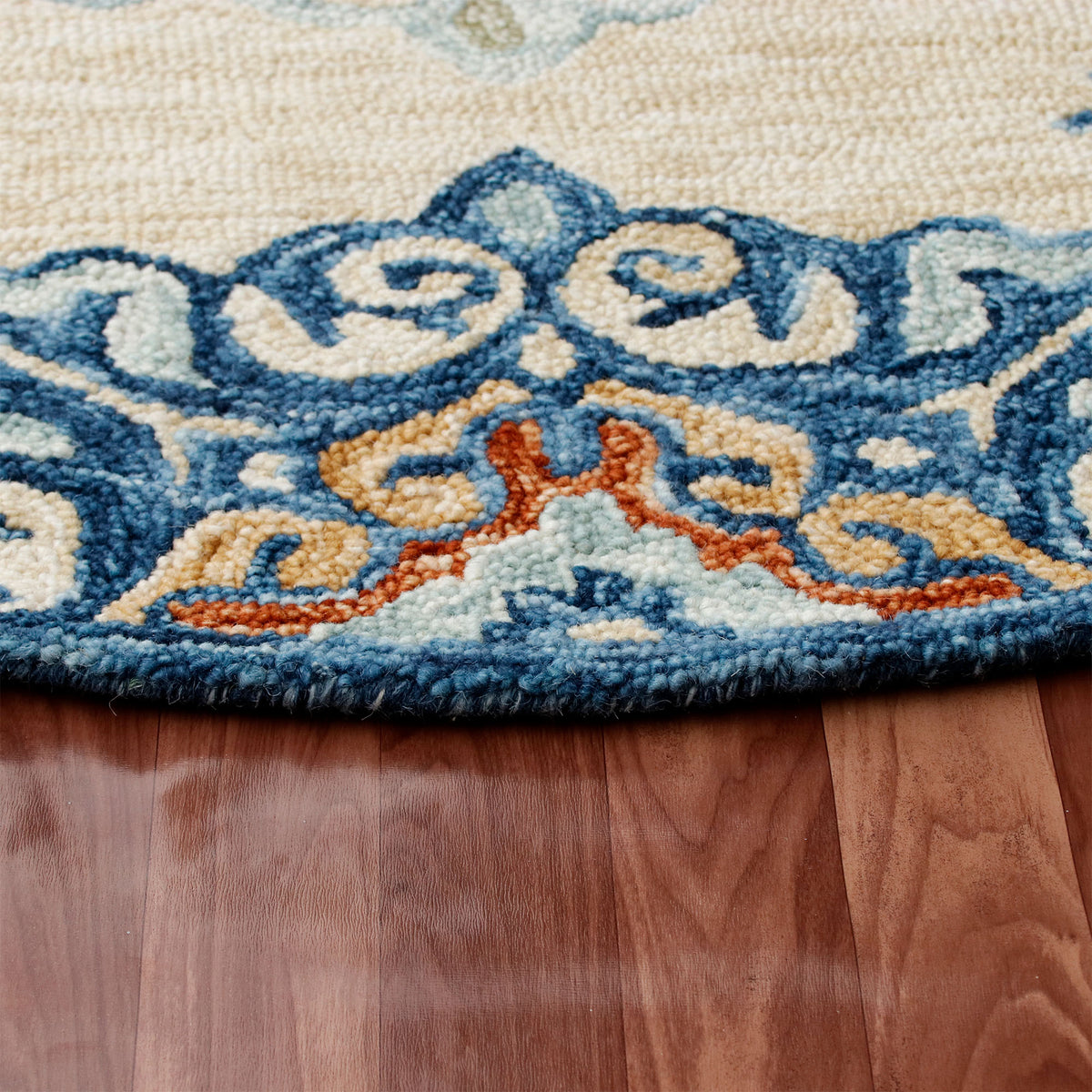 RugsA Beige/Blue Medallion Wool Round Rug - side angle view
