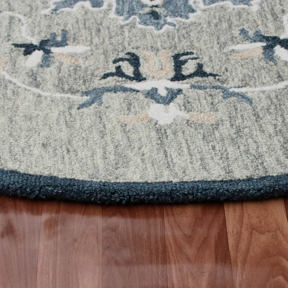 RugsA Gray/Blue Medallion Wool Round Rug - side angle view