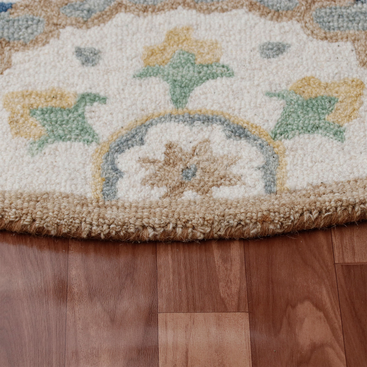 RugsA Gray/Brown Suzani Wool Round Rug - side angle view