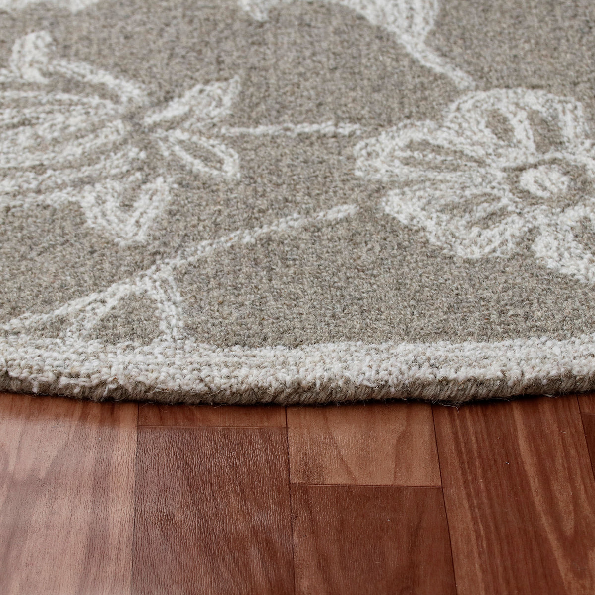 RugsA Gray/Ivory Floral Wool Round Rug - side angle view