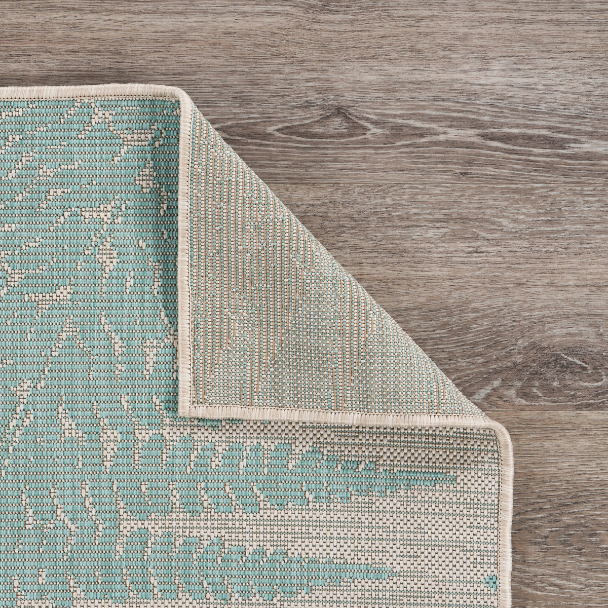 Teal Fallen Fern Indoor/Outdoor Rug - close-up detail
