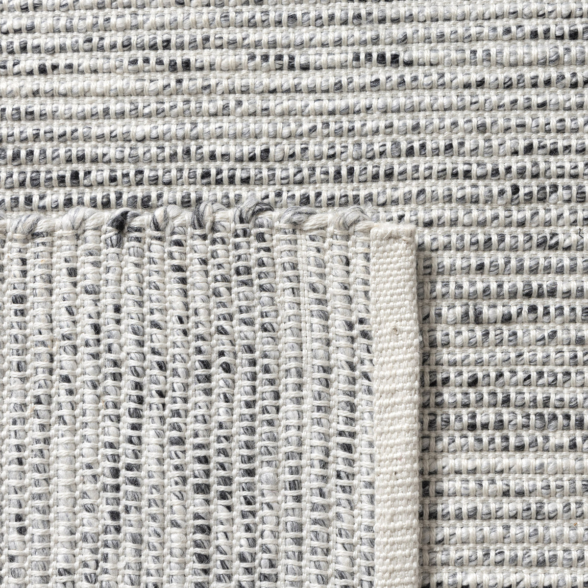 Silver/Ivory Contemporary Solid Hand-Woven Polyester Indoor Area Rug - back view