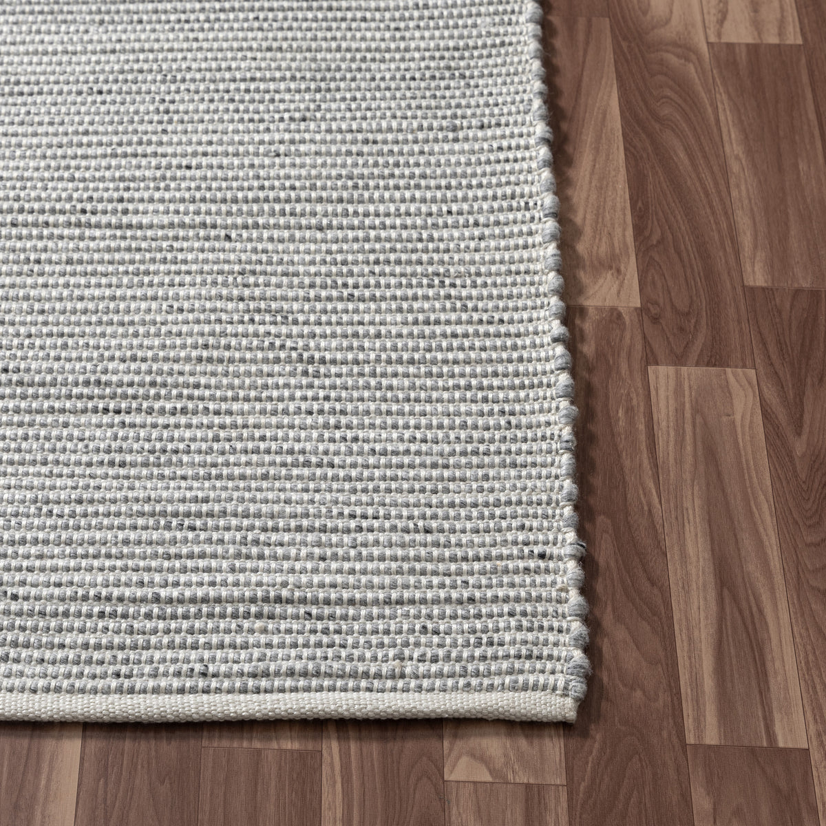 Gray/Ivory Contemporary Solid Hand-Woven Polyester Indoor Area Rug - corner view