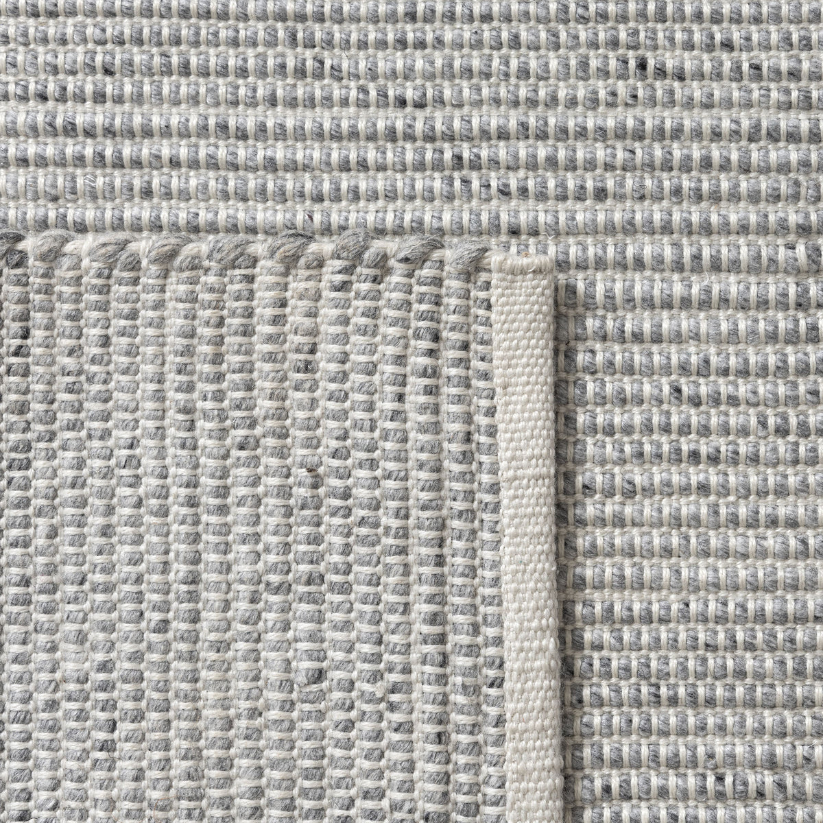 Gray/Ivory Contemporary Solid Hand-Woven Polyester Indoor Area Rug - back view