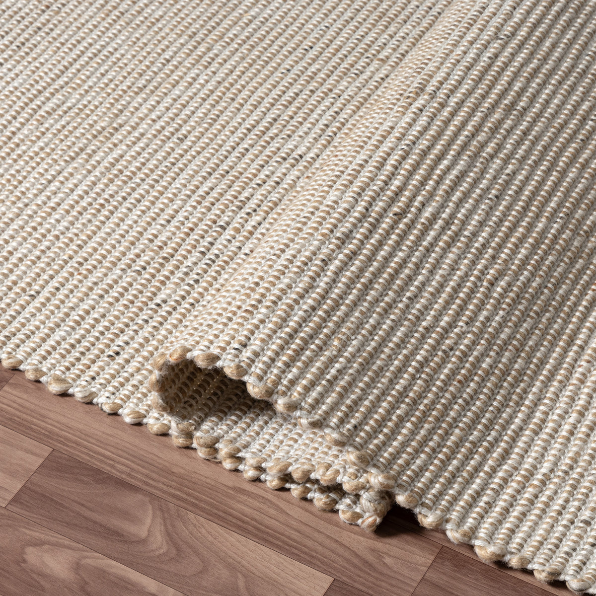 Beige/Ivory Contemporary Solid Hand-Woven Polyester Indoor Area Rug - close-up detail