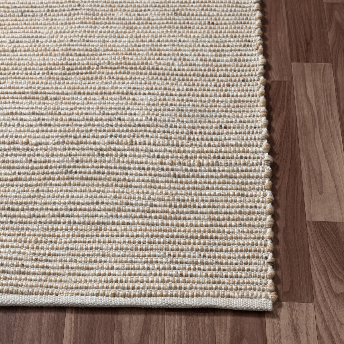 Beige/Ivory Contemporary Solid Hand-Woven Polyester Indoor Area Rug - corner view