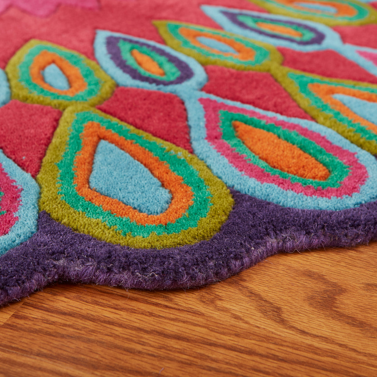 Pink Peacock Indoor Area Rug - side angle view