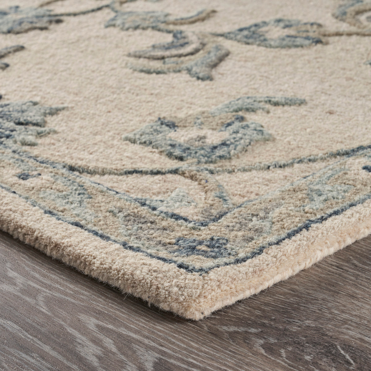 Mirroring Ivory and Blue Floral Bloom Area Rug - side angle view
