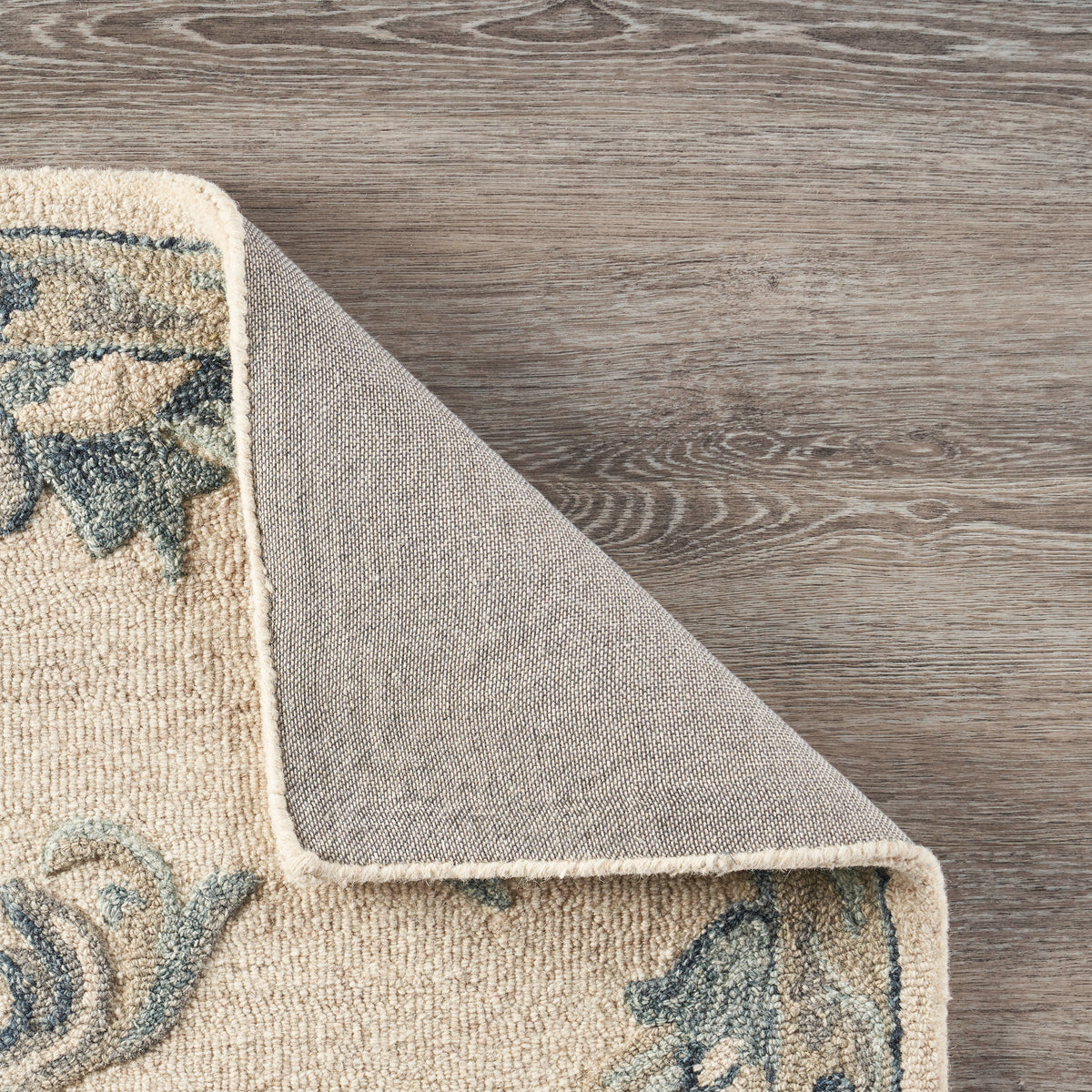 Mirroring Ivory and Blue Floral Bloom Area Rug - back view
