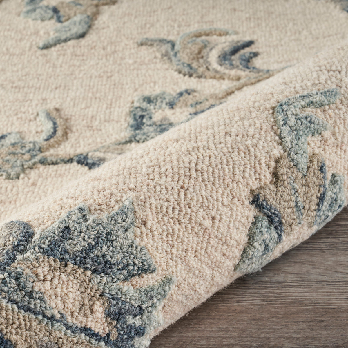 Mirroring Ivory and Blue Floral Bloom Area Rug - close-up detail