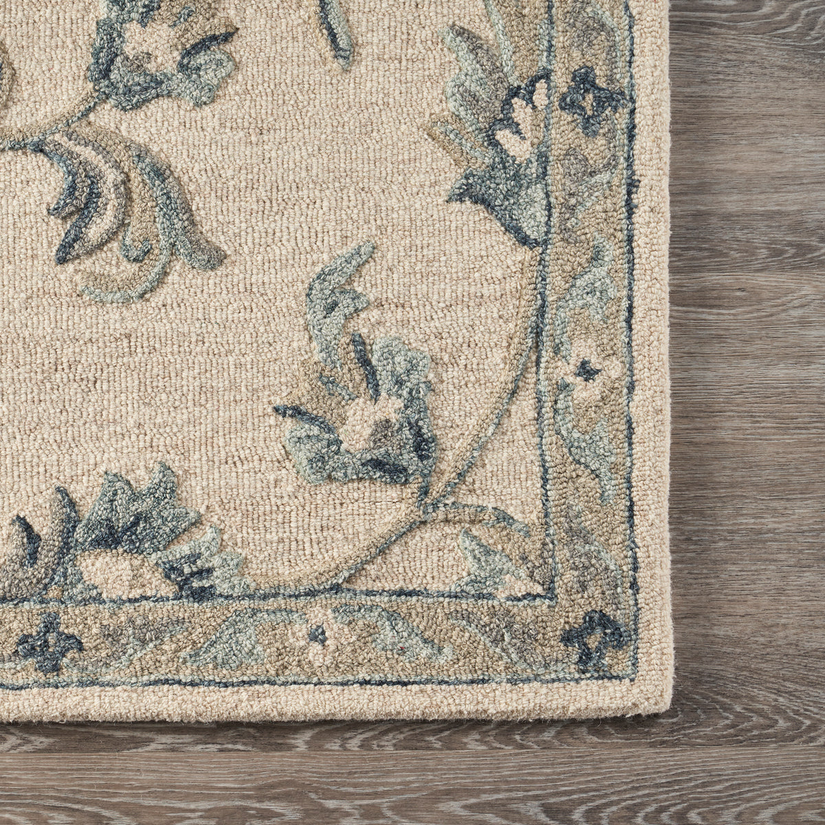 Mirroring Ivory and Blue Floral Bloom Area Rug - corner view