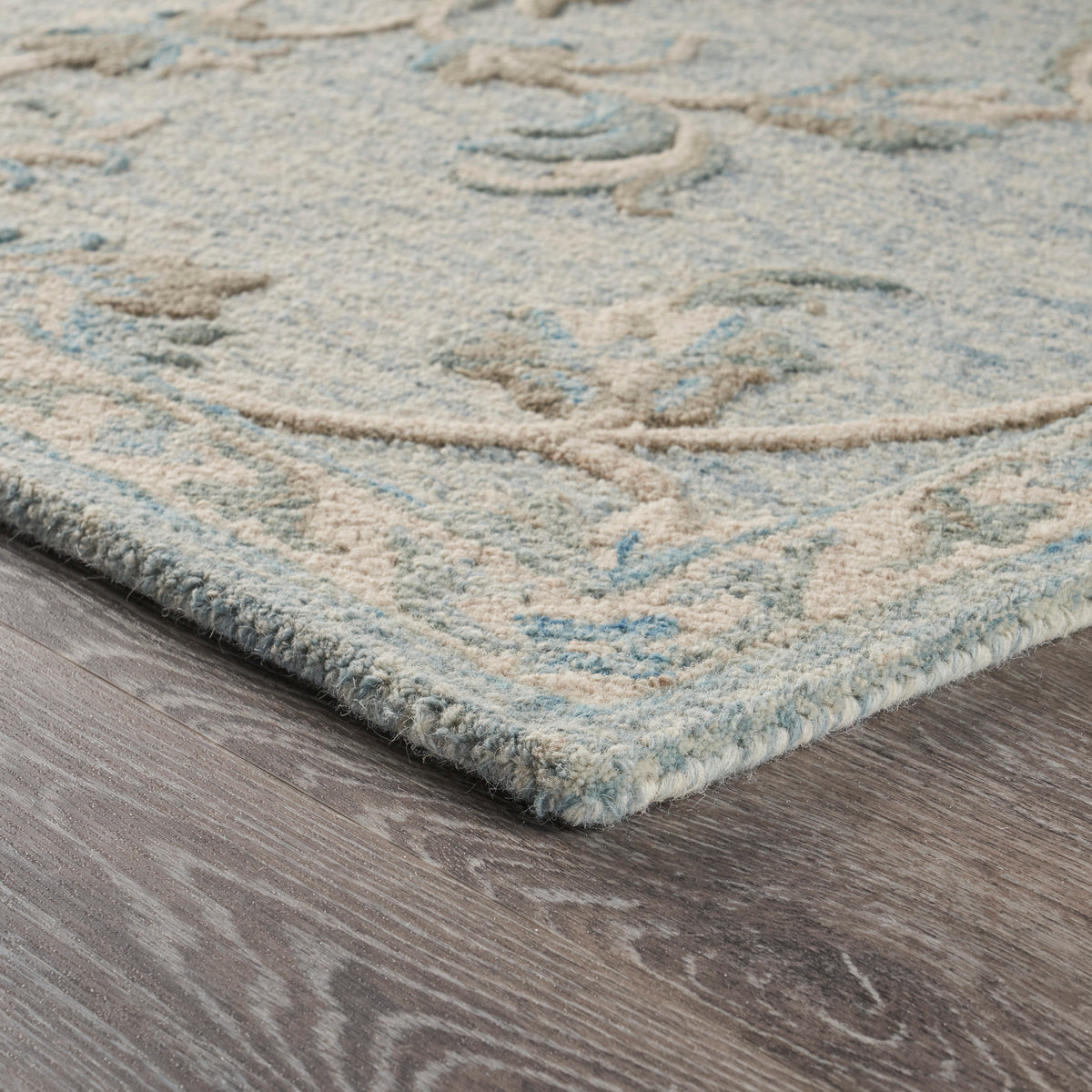 Mirroring Baby Blue Floral Bloom Area Rug - side angle view