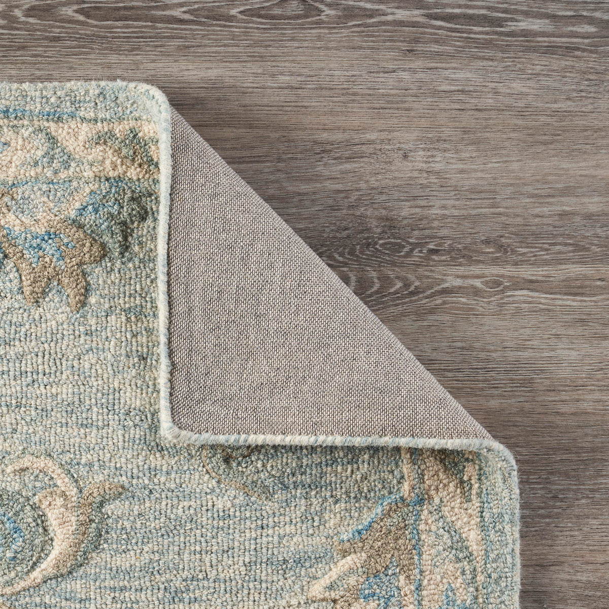 Mirroring Baby Blue Floral Bloom Area Rug - back view