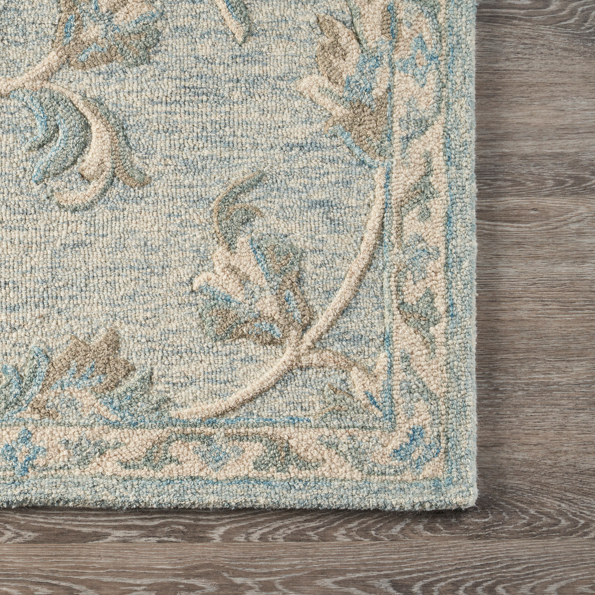 Mirroring Baby Blue Floral Bloom Area Rug - corner view